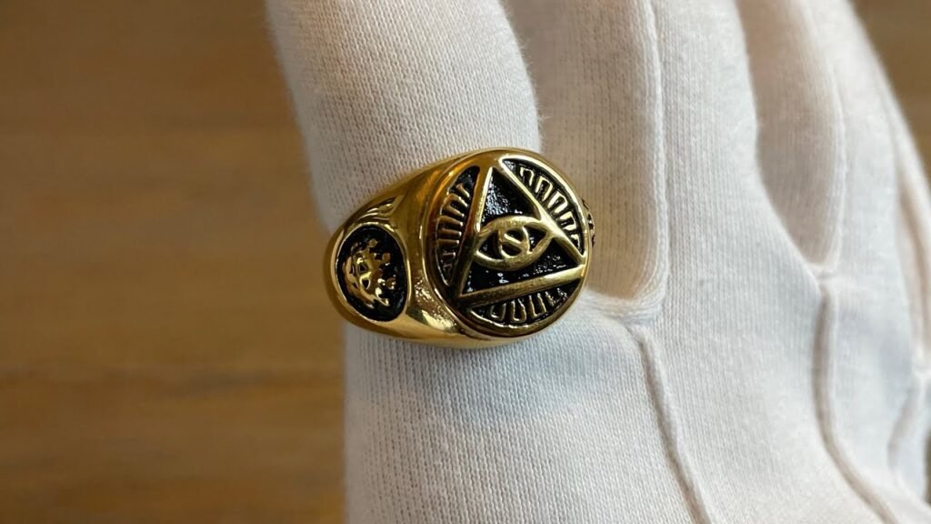 the illuminati official page - Gold ring with intricate design